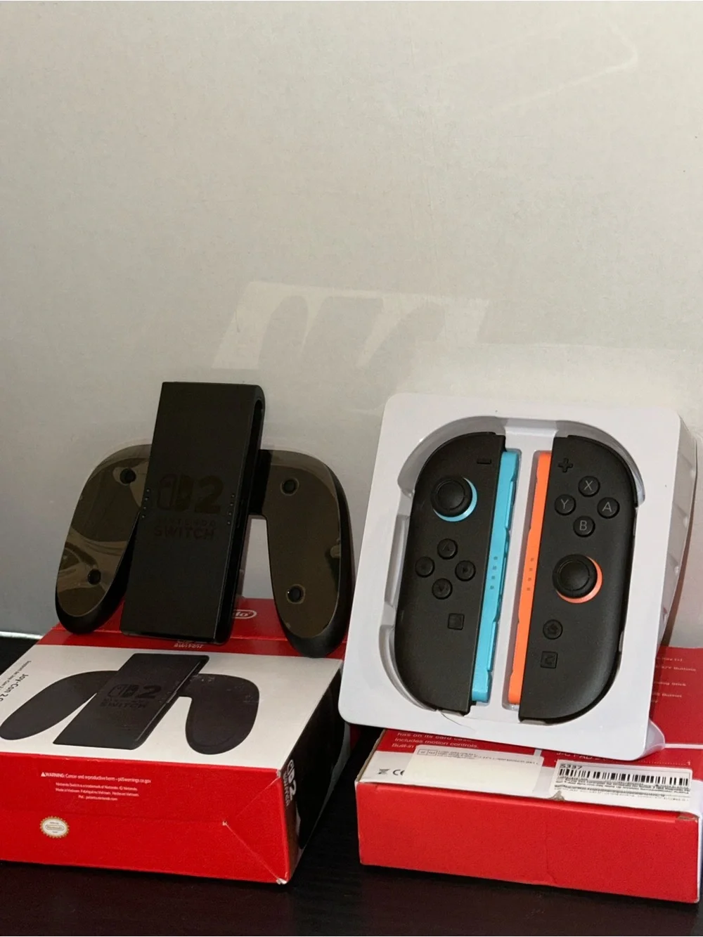 Nintendo Wireless Joy-Con Blue and Orange Accents with Nintendo game grip